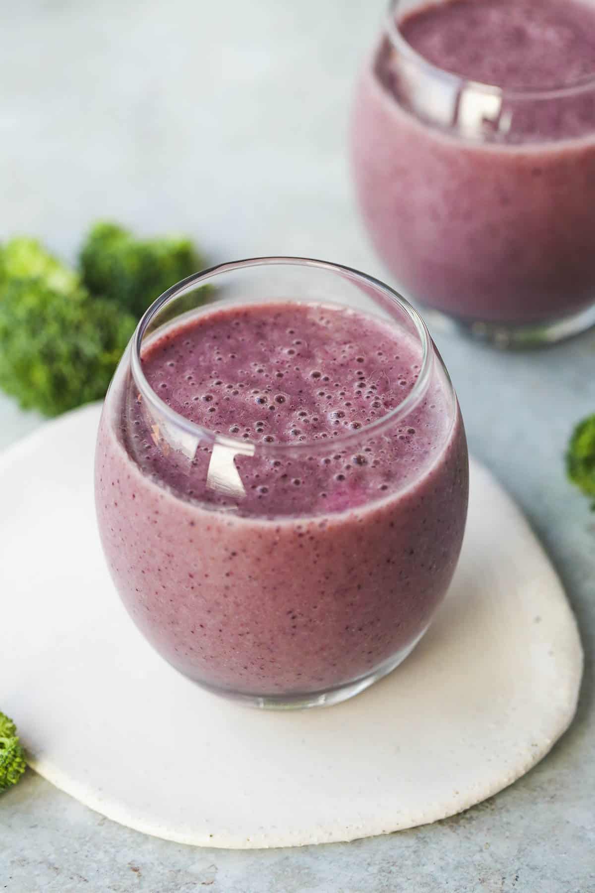 Blueberry Broccoli Smoothie served in two glasses.