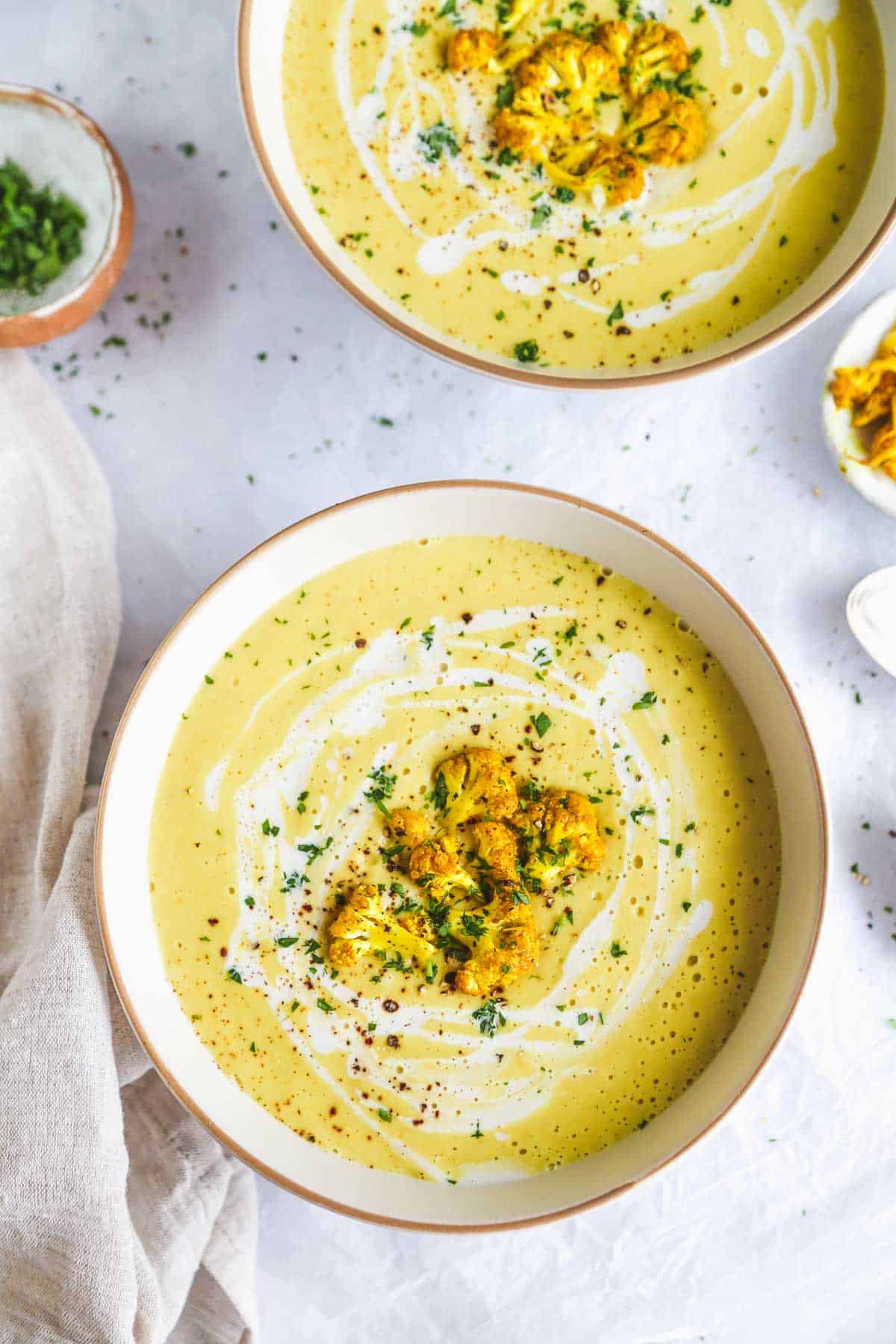 Curried Cauliflower Soup topped with roasted cauliflower florets