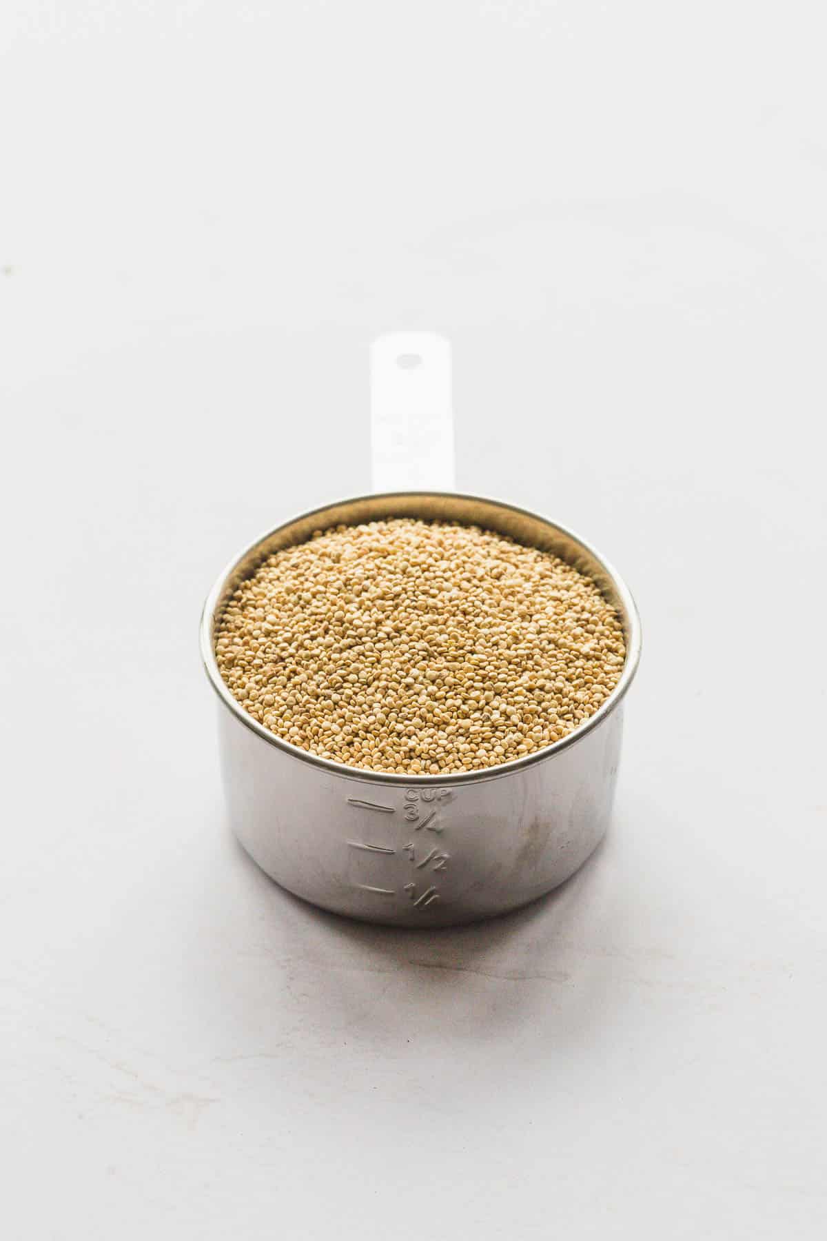 A metalic cup with quinoa seeds