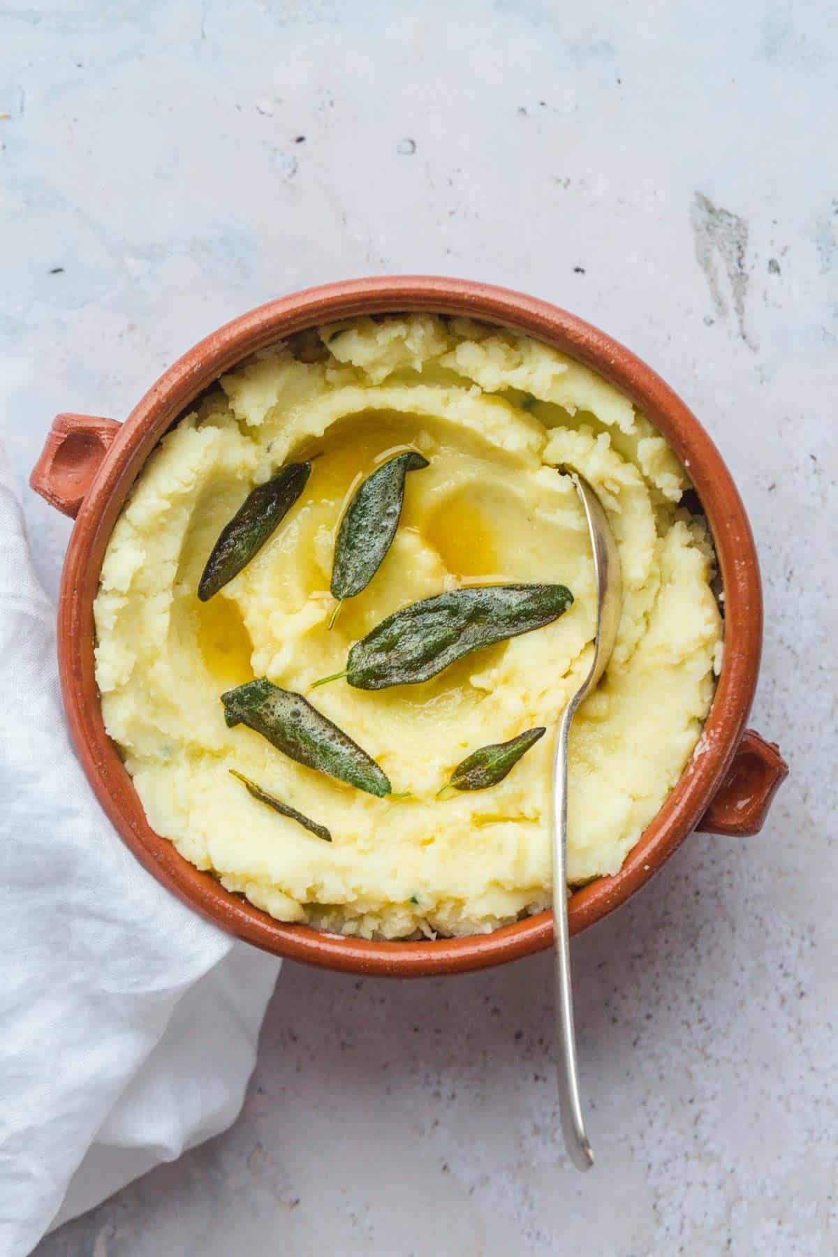 Vegan Mashed Potatoes topped with sage leaves