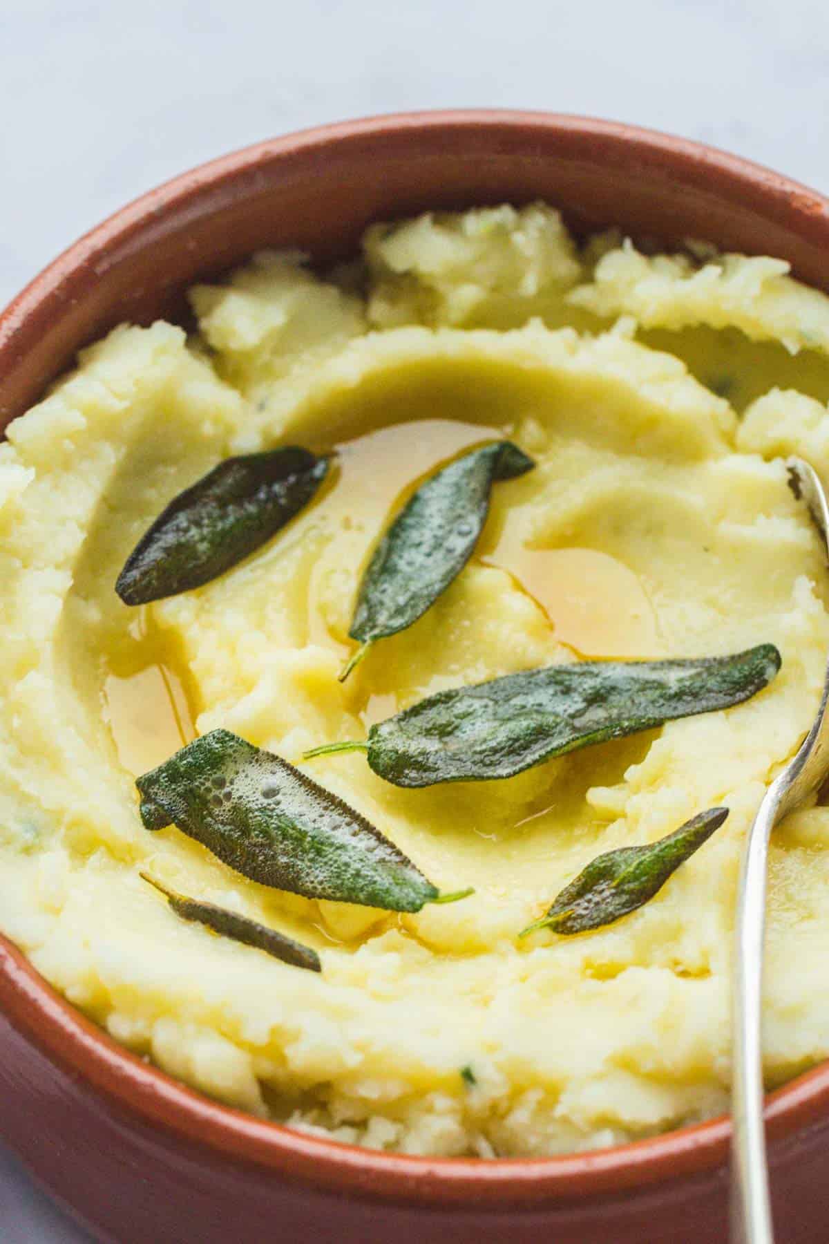Vegan Mashed Potatoes in a bowl, with sage butter