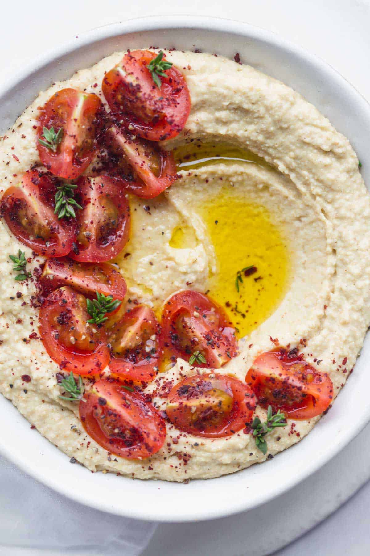 Hummus decorated with cherry tomatoes