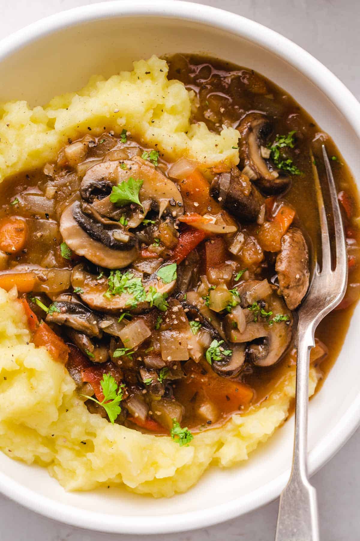 Mushroom Stew in a bowl with a fork on the side