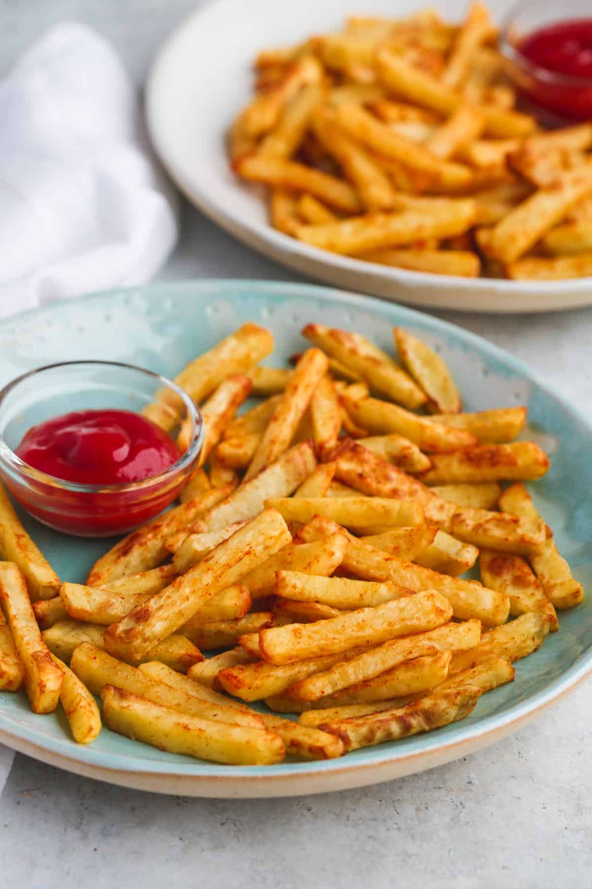 Air Fryer French fries served on a plate with ketchup