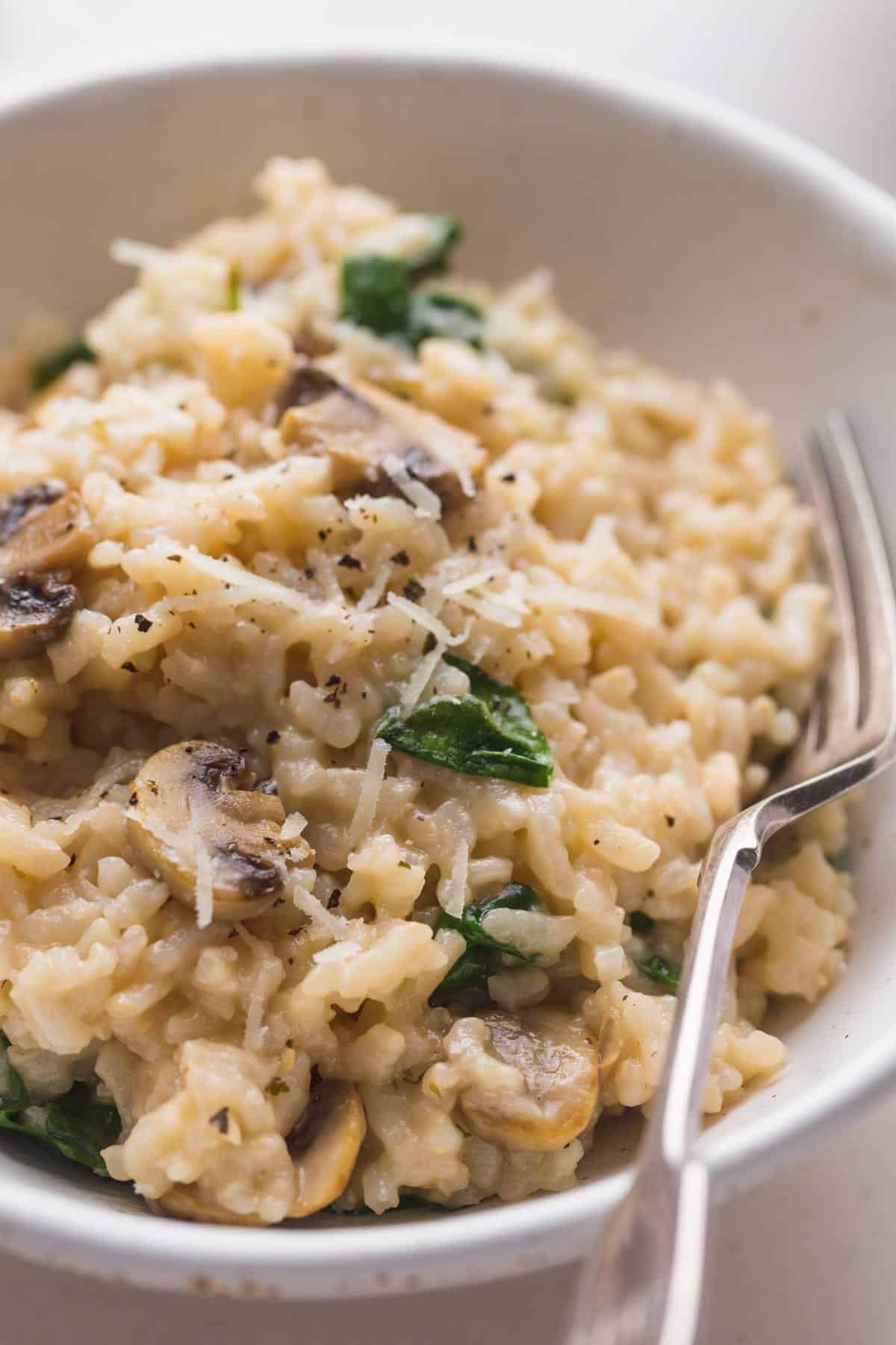 Instant Pot Risotto served in a white bowl