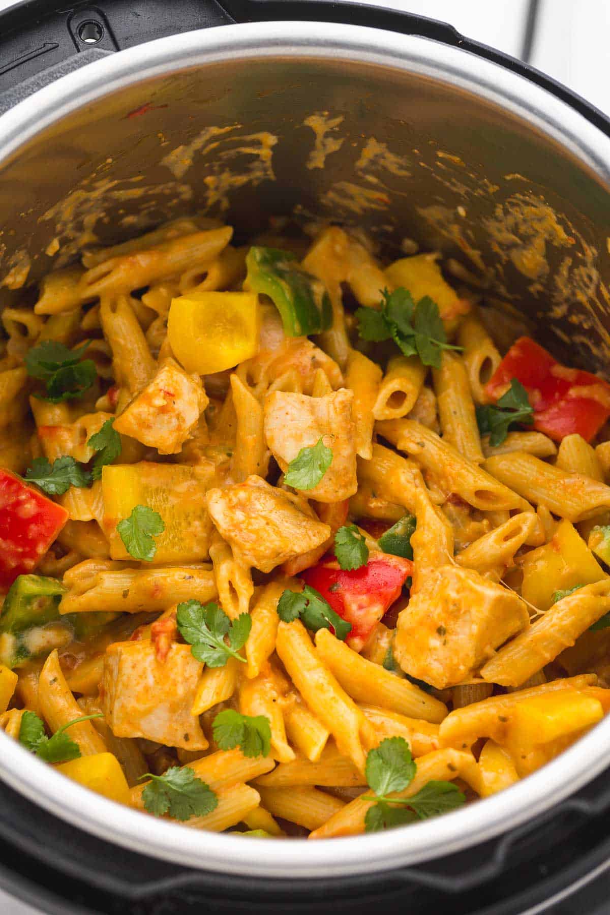 Chicken fajita pasta in the Instant Pot with fresh cilantro leaves