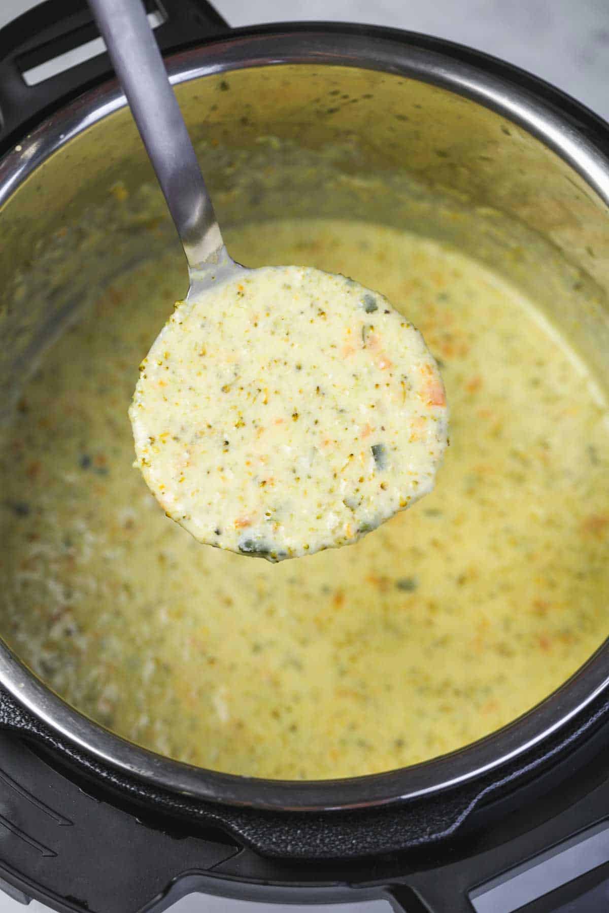 Showing the thick and rich texture of Broccoli Cheddar Soup