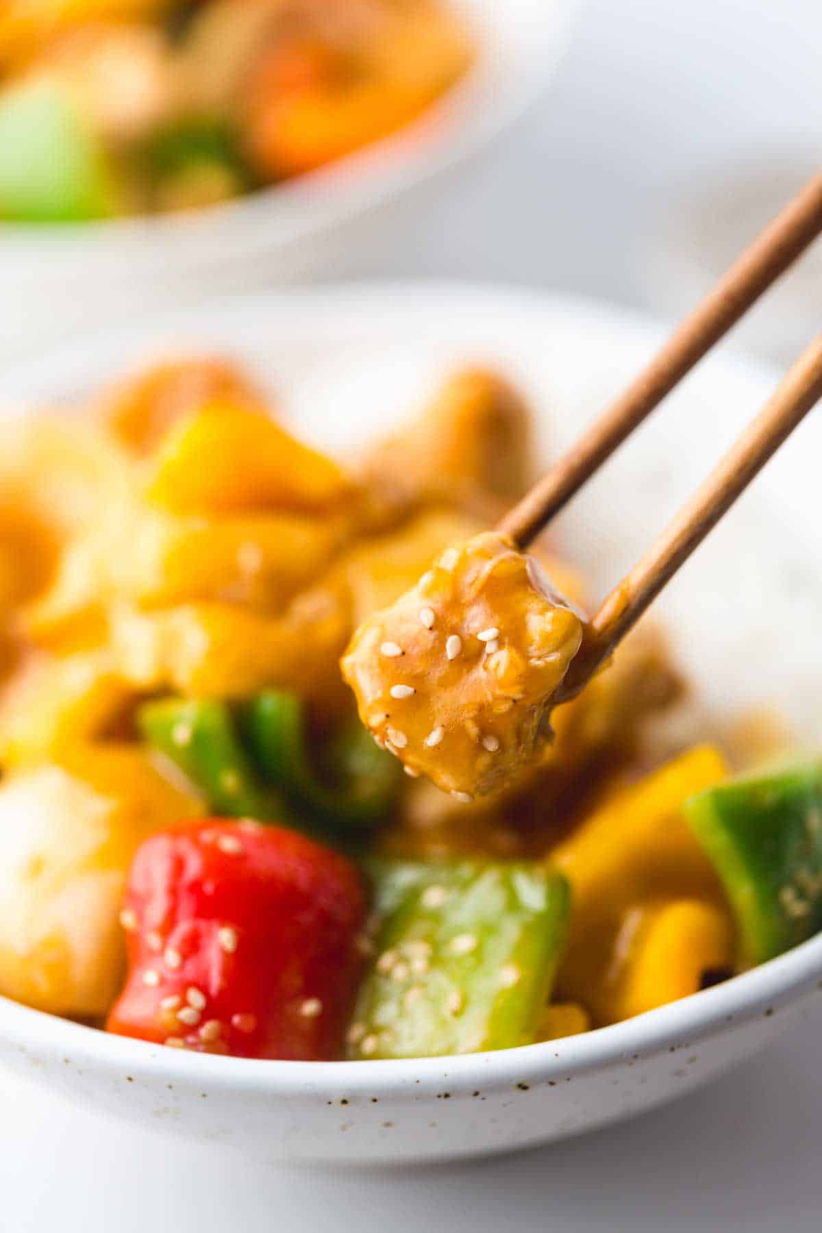 Sweet And Sour Chicken tossed with toasted sesame seeds
