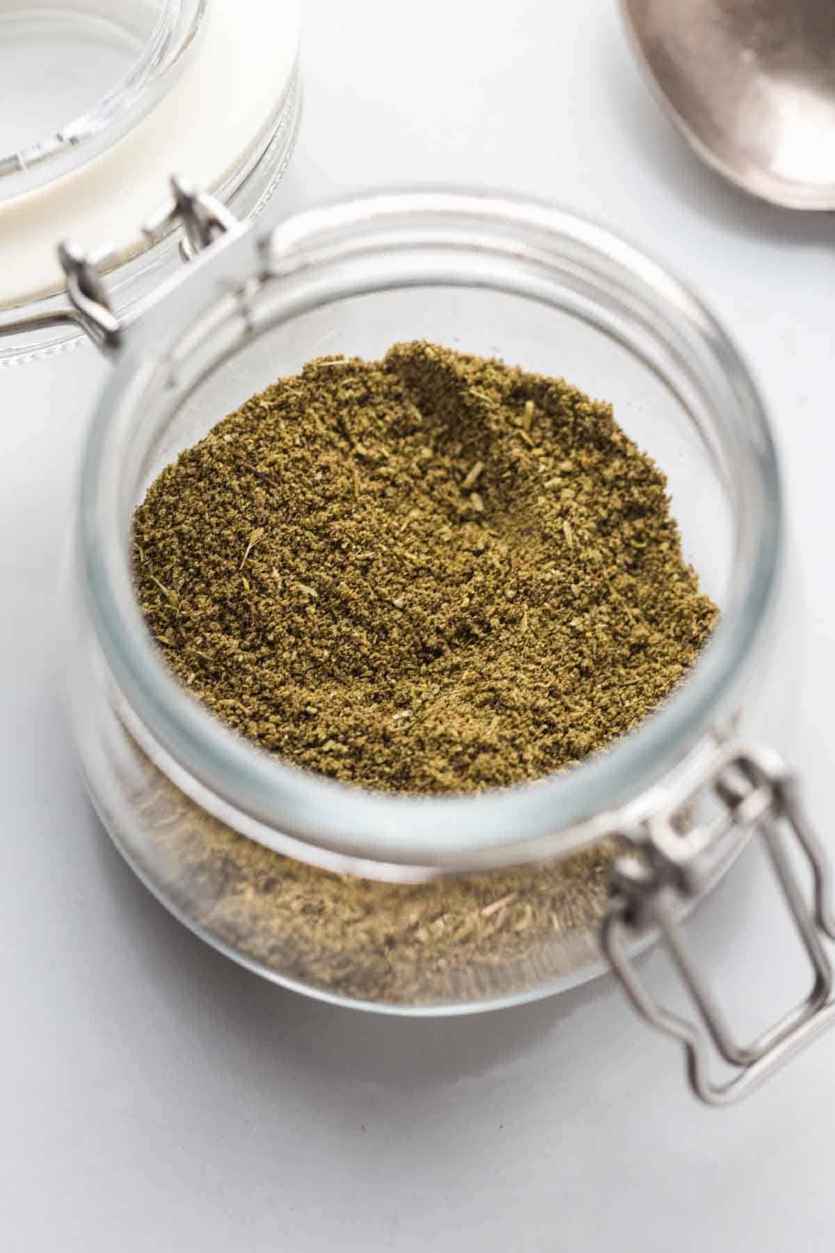 Ground Poultry Seasoning stored in a glass jar