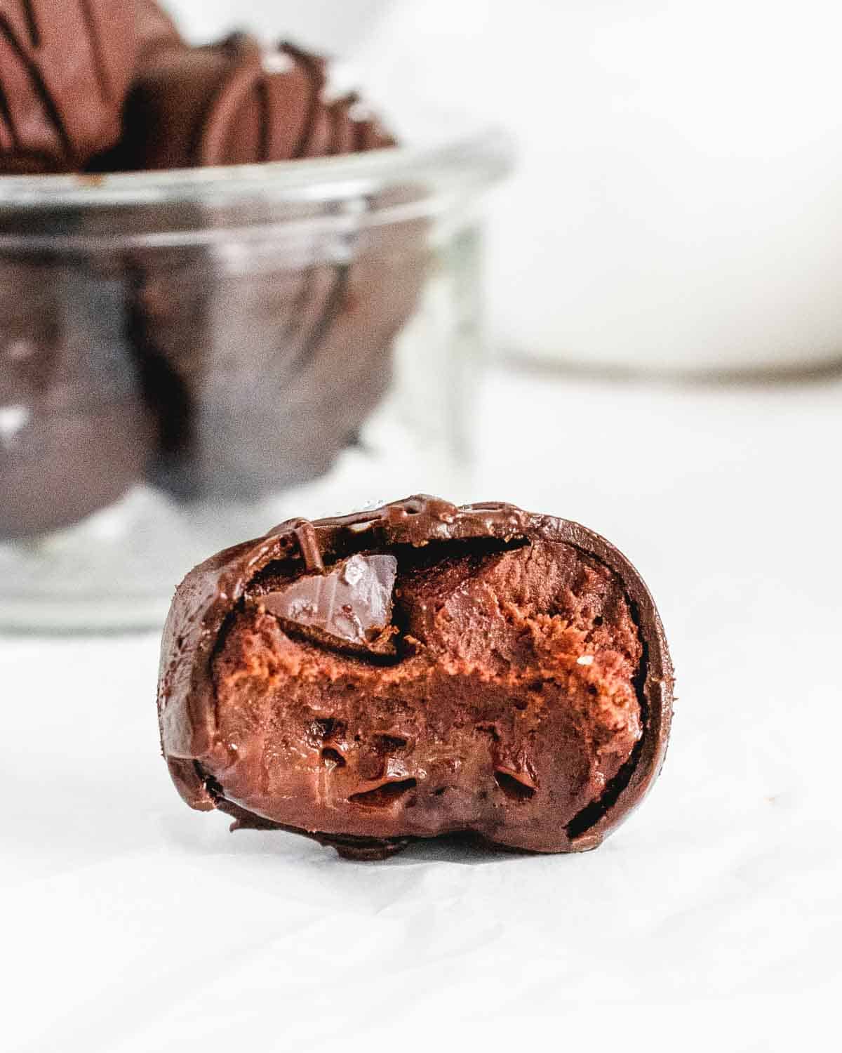 A close up bite shot of chocolate truffles 