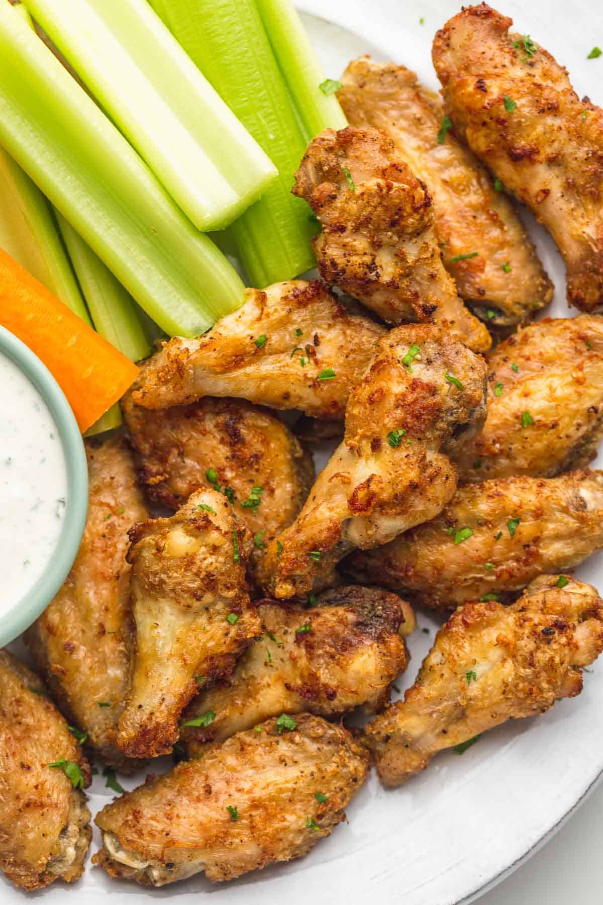 Air Fryer Chicken Wings served with carrot and celery sticks and ranch dip 