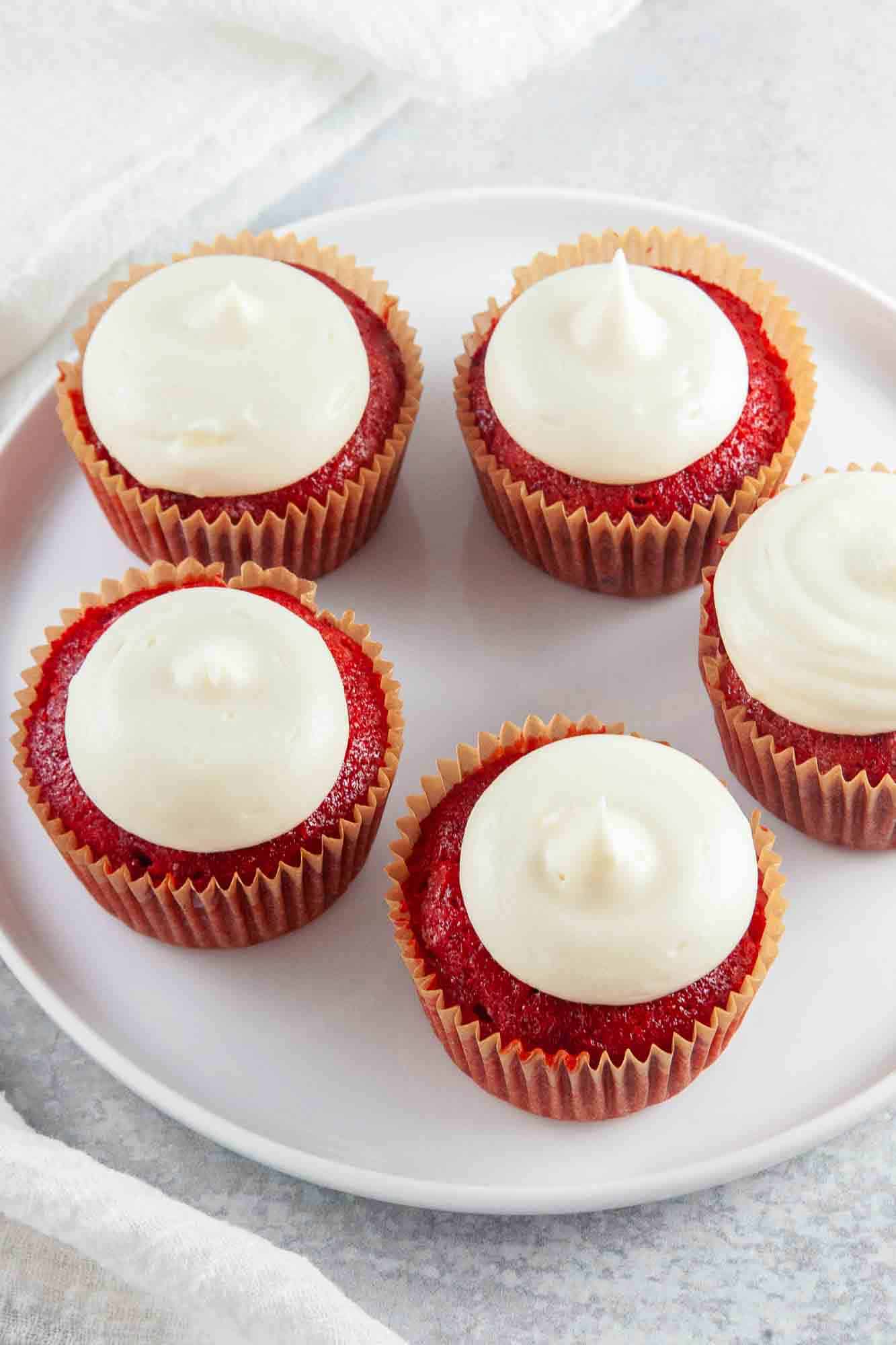 A plate with 5 Red Velvet Cupcakes