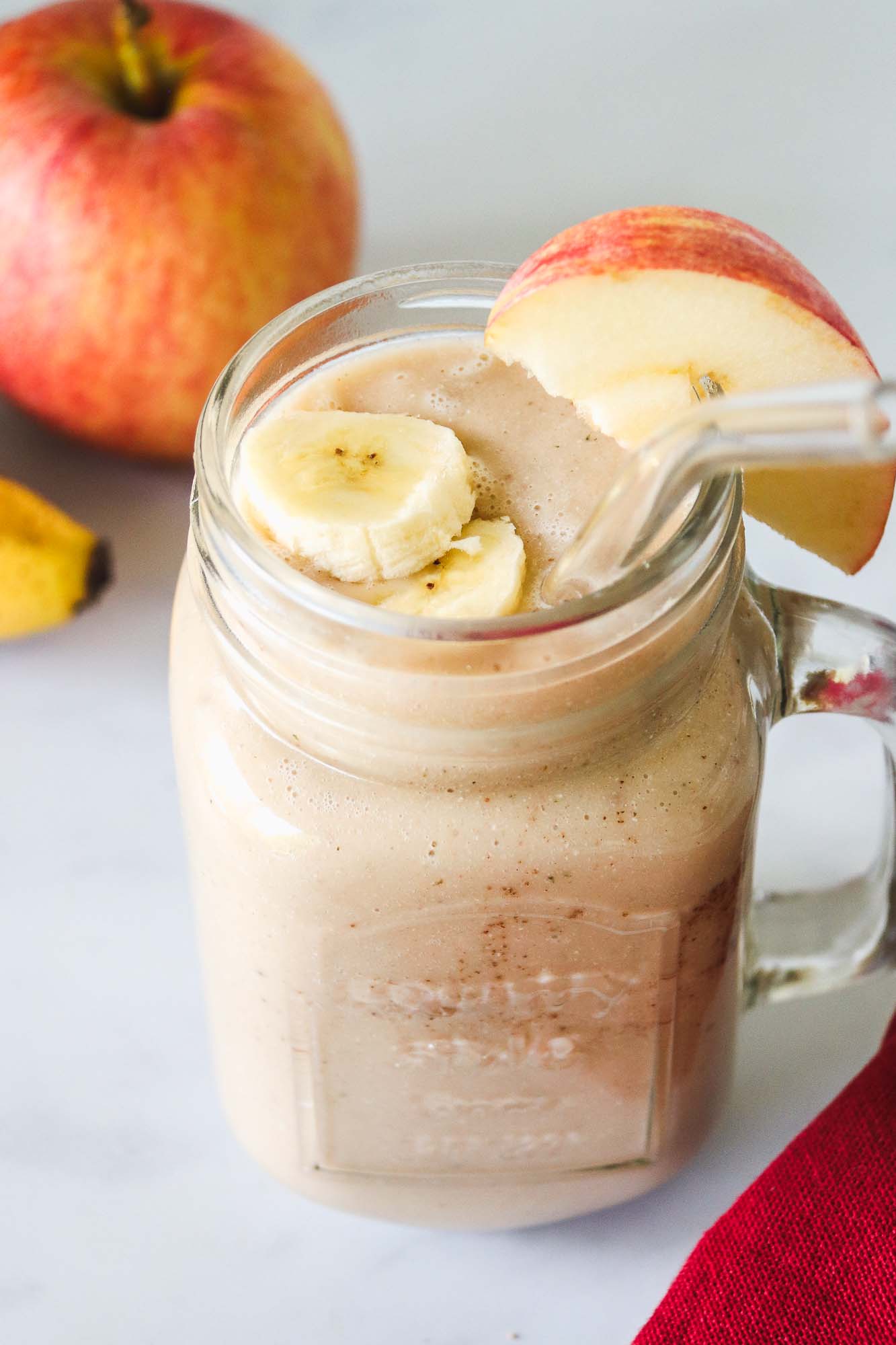 Apple Banana Smoothie served with apple and banana slices