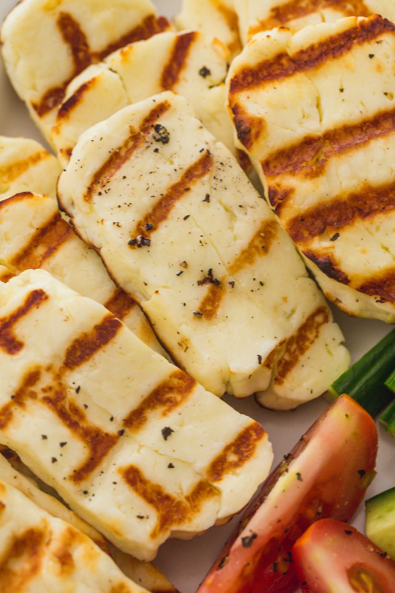 Close up of grilled halloumi slices