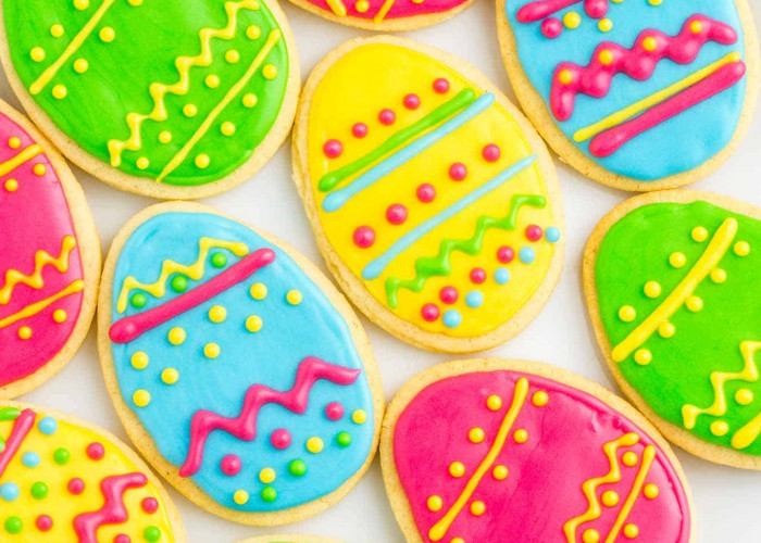 Overhead shot of colorful Easter egg sugar cookies decorated with bright royal icing