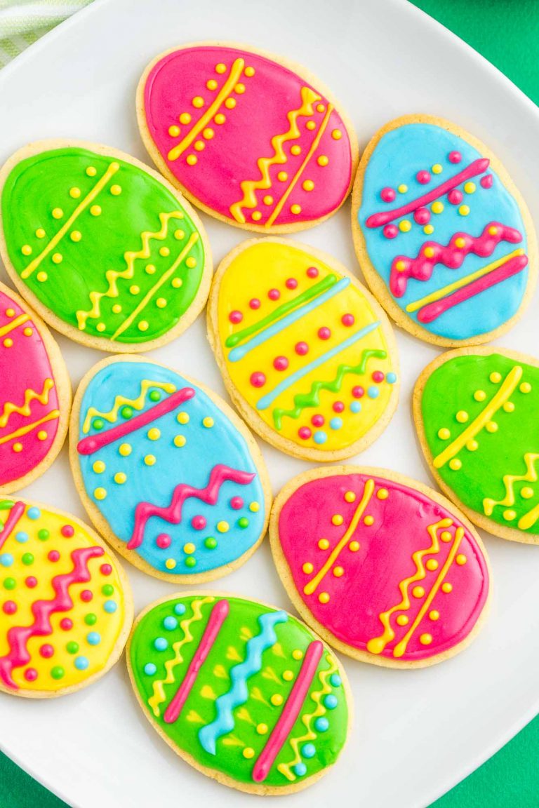 Overhead shot of colorful Easter egg sugar cookies decorated with bright royal icing