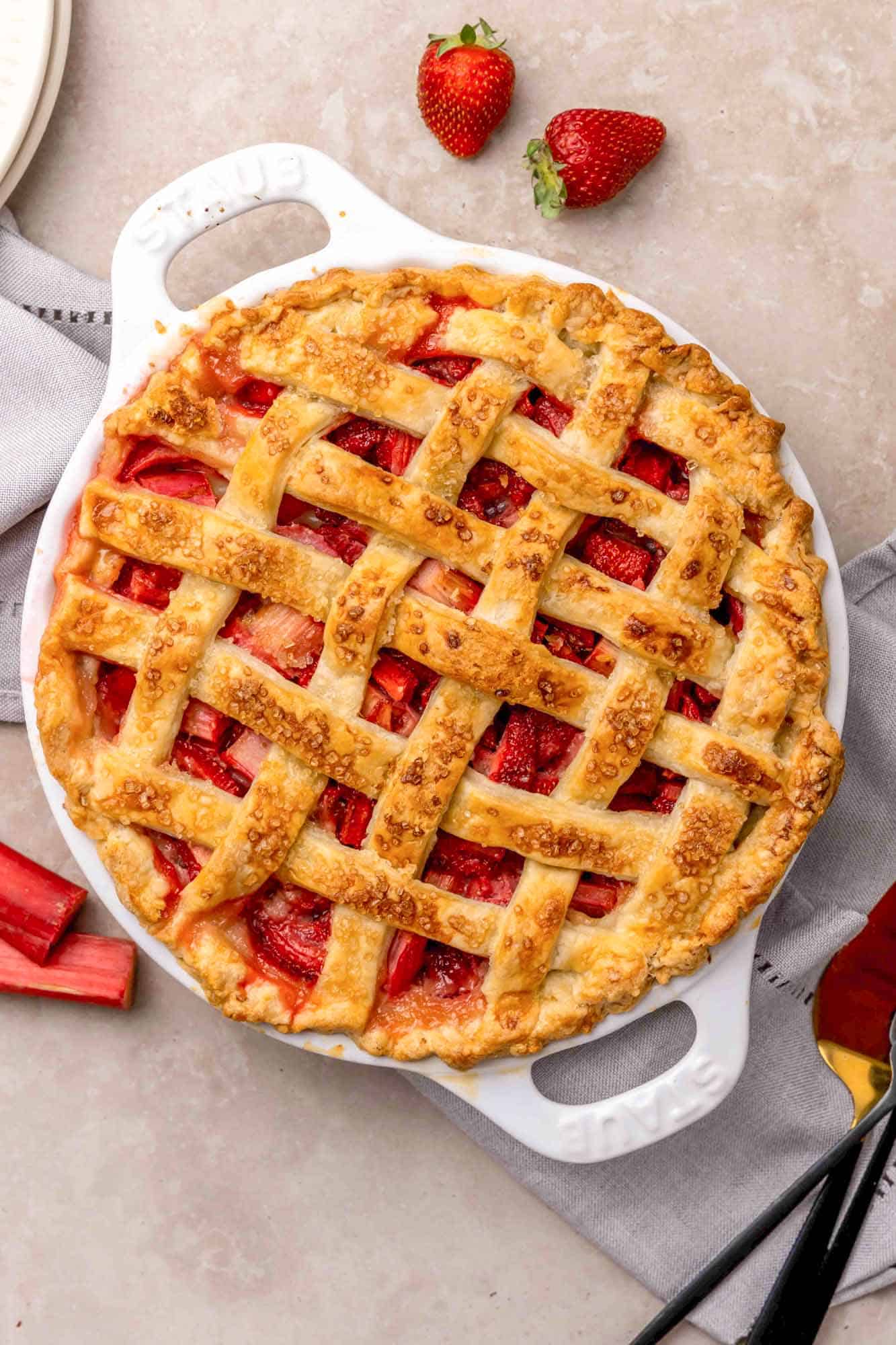 A Strawberry Rhubarb Pie in a white baking dish
