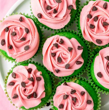 Overhead shot of watermelon cupcakes on a white plate