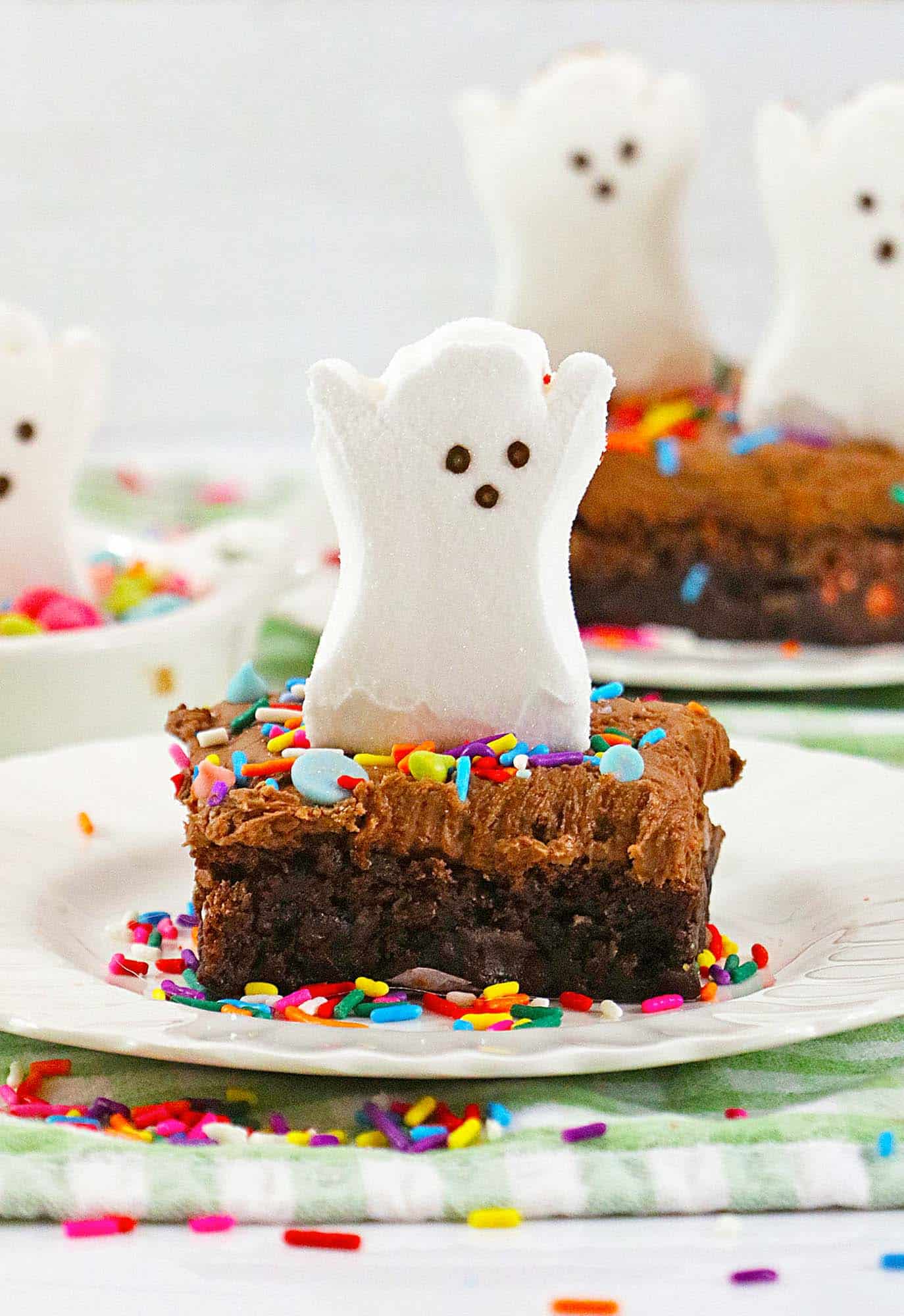 Ghost peep on top of a frosted brownie with sprinkles
