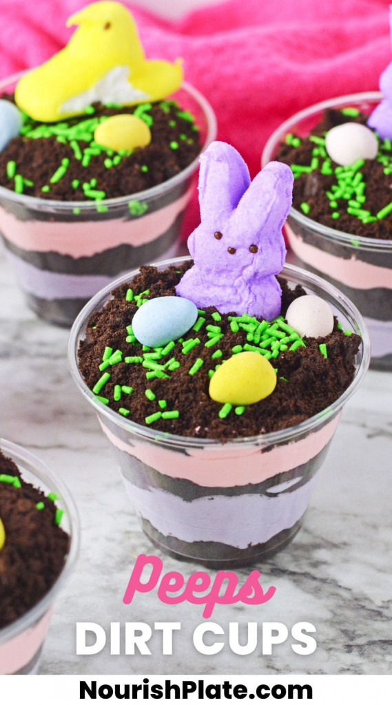 Easter dirt cups with layered instant pudding in colors, topped with peeps and mini eggs. And overlay text that says "Peeps Dirt Cups"