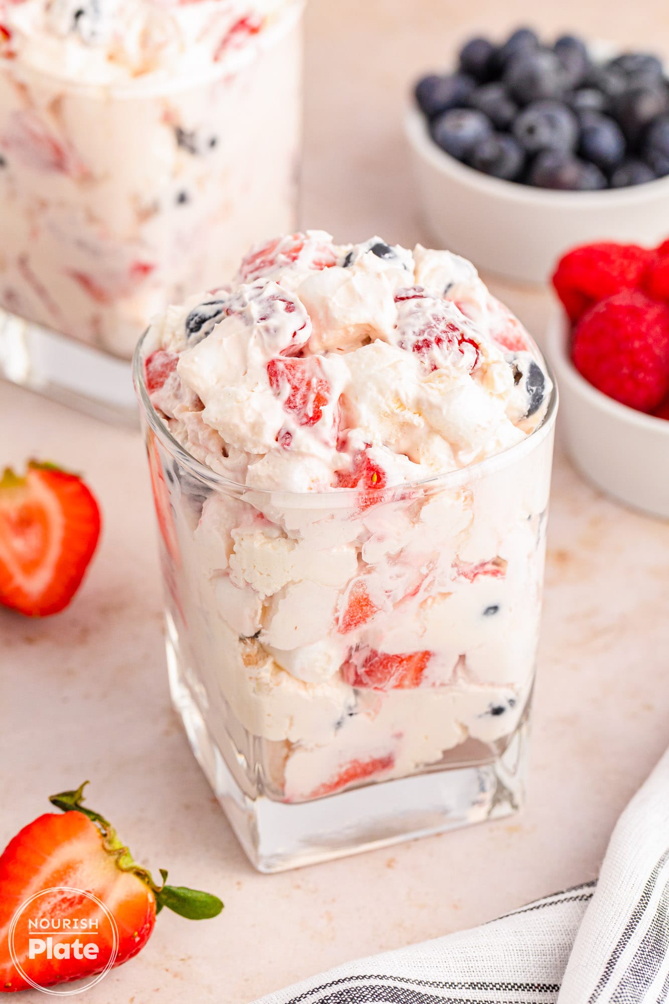 Berry cheesecake fluff salad served in transparent glass cups