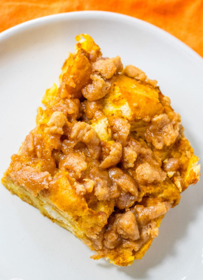 Overhead shot of a piece of pumpkin french toast casserole served on a small white plate