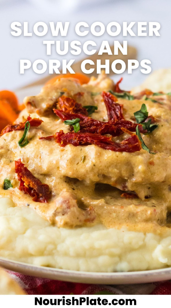 Creamy tuscan pork chops served over mashed potatoes on a plate, and overlay text that says "slow cooker tuscan pork chops"