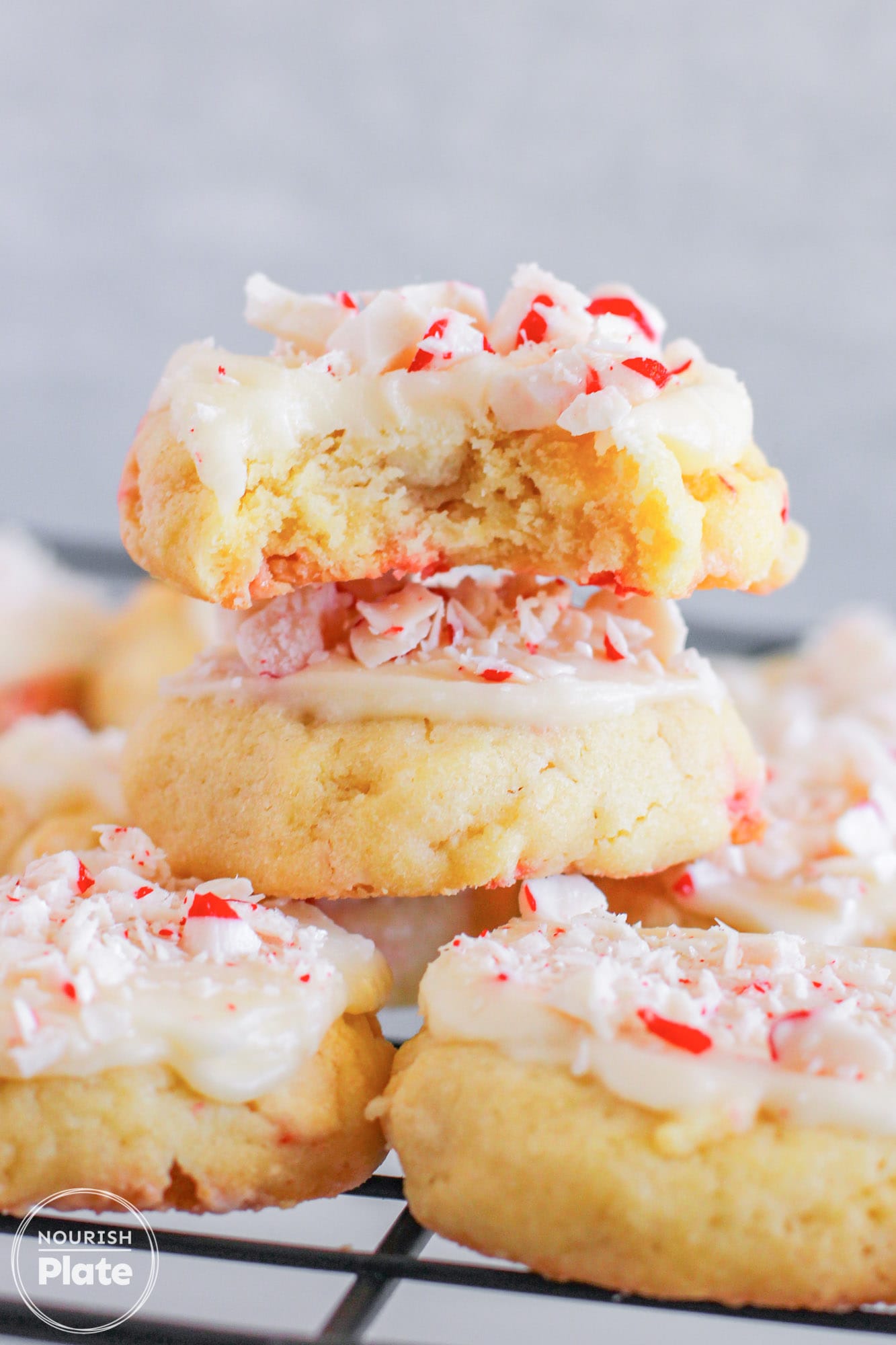Stacked White Chocolate Peppermint Cookies showing a bite shot