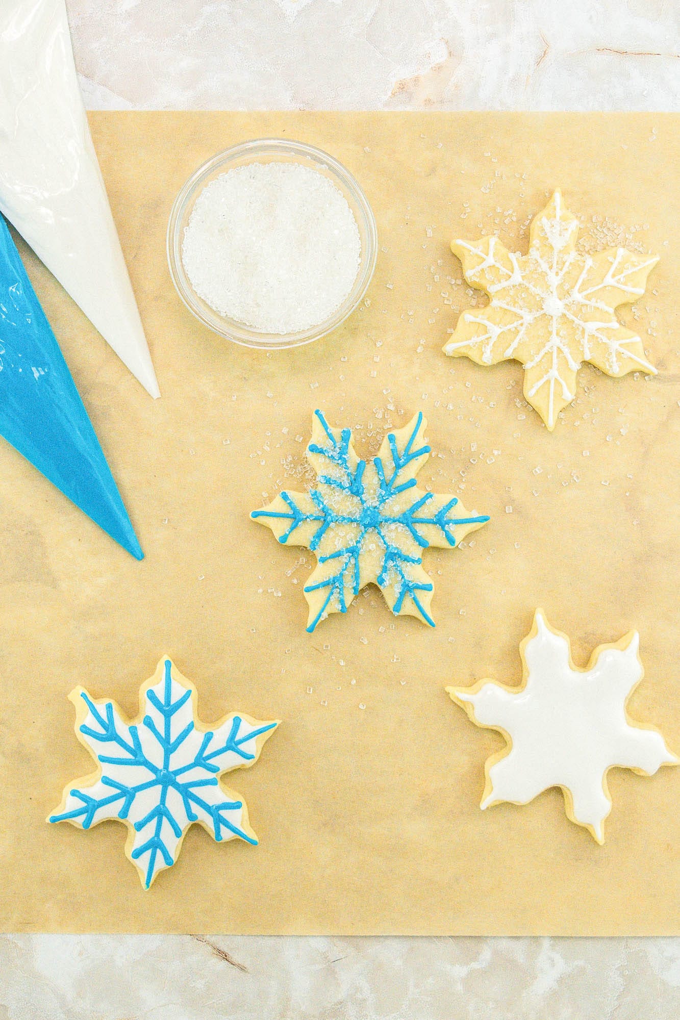 Decorated snowflake sugar cookies with blue and white royal icing