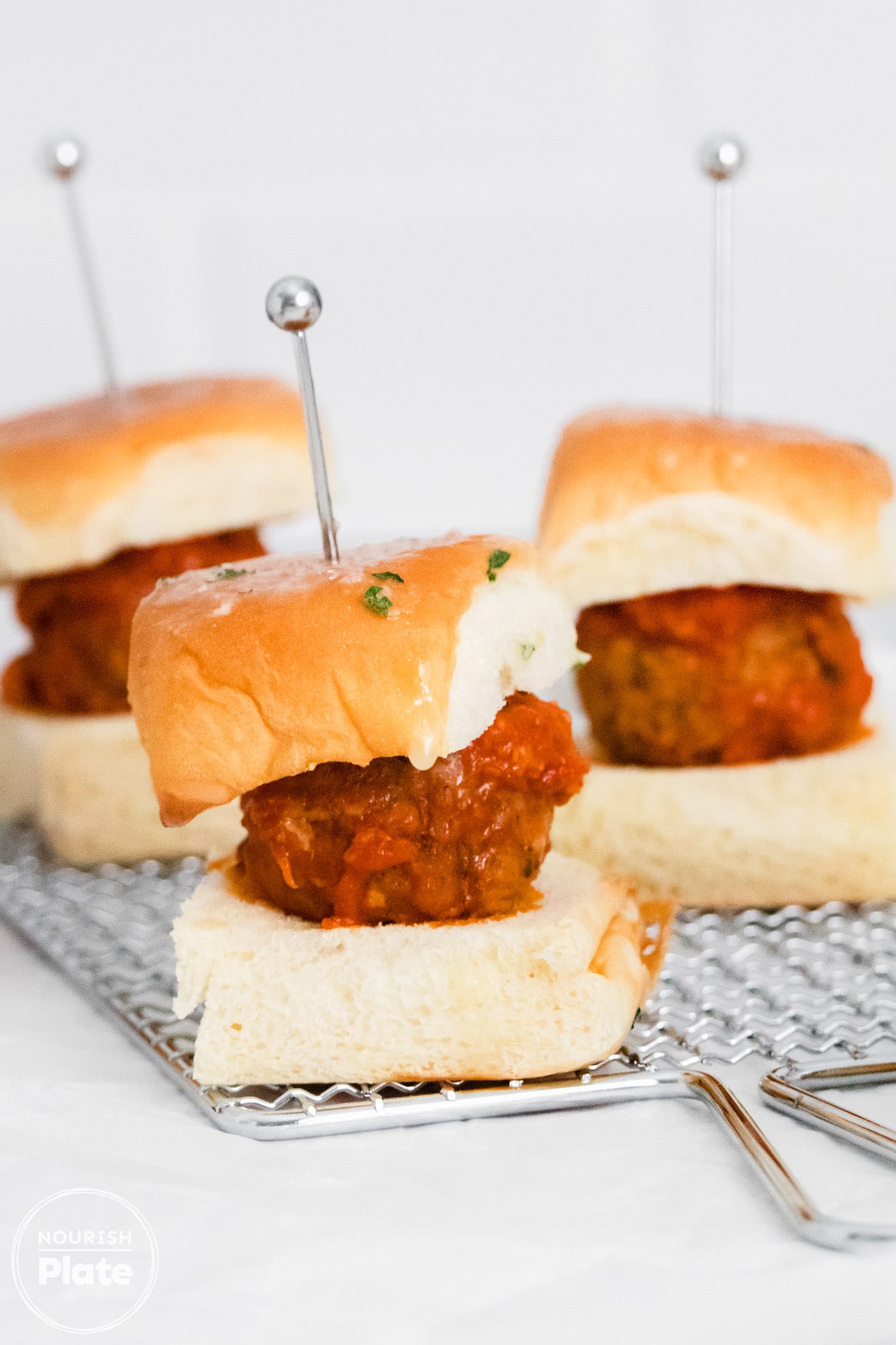 Meatball sliders on a white background