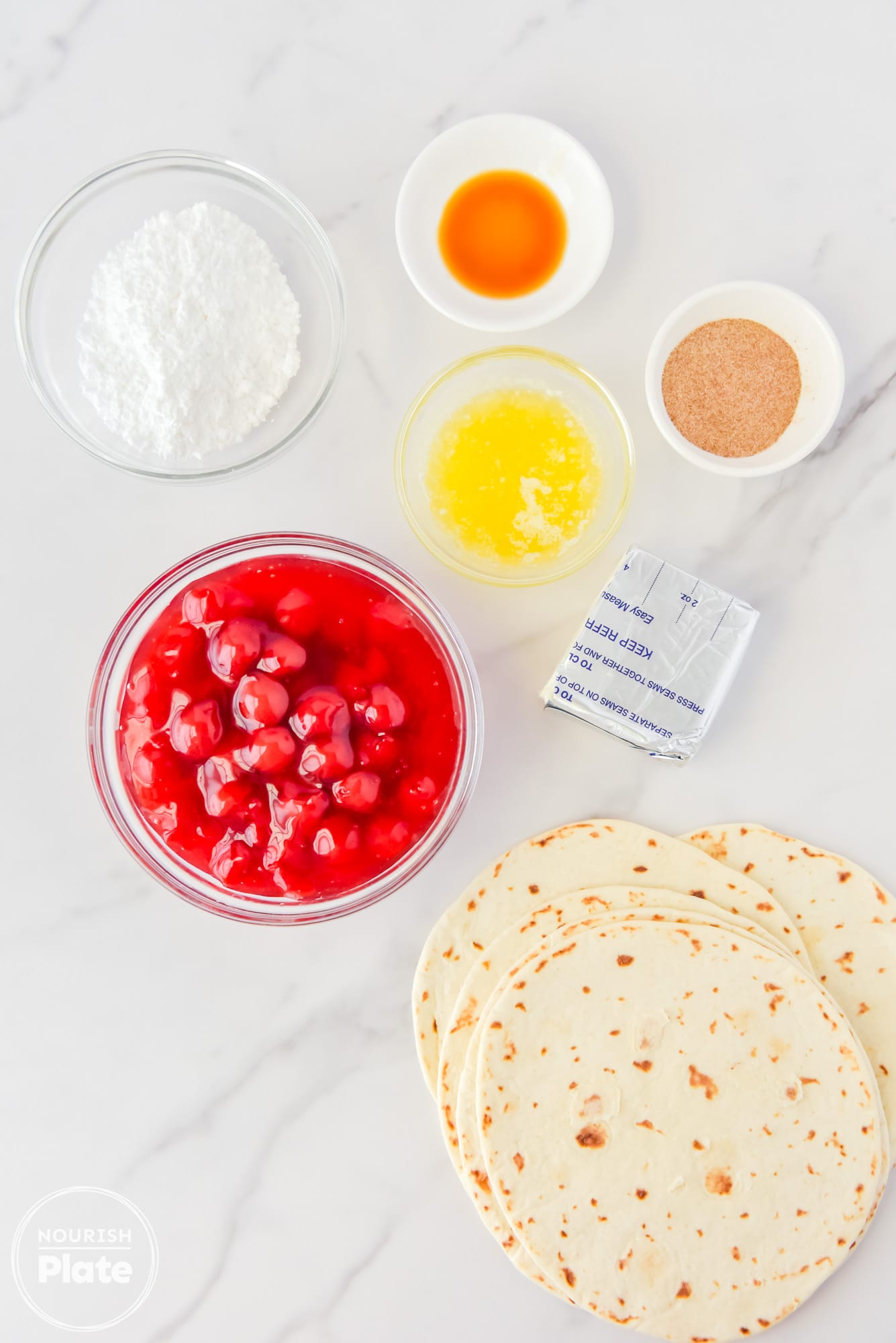Ingredients needed to make cherry cheesecake, taquitos, including cherry pie, filling, flour, tortillas, cream cheese, powdered sugar, butter, cinnamon, sugar, and vanilla extract