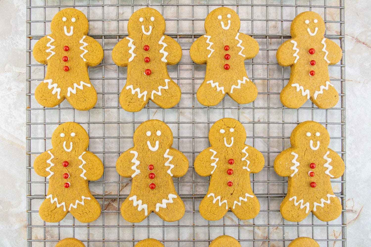 Iced gingerbread men cookies on a wire rack