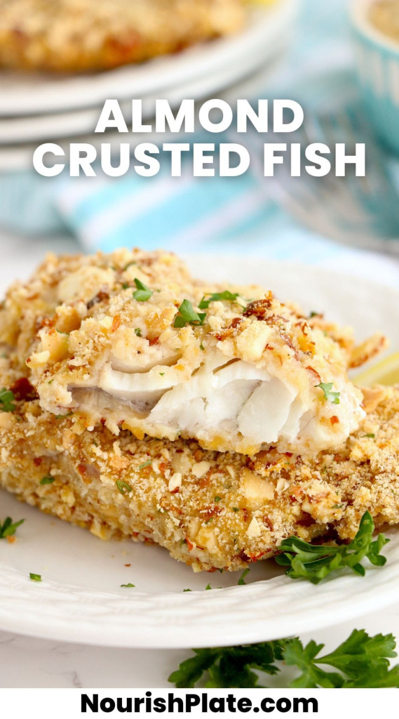 Stacked 2 pieces of almond crusted walleye fish fillets, showing the inside texture, and overlay text that says "almond crusted fish"