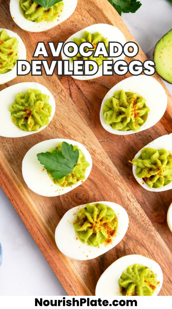 Overhead shot of avocado deviled eggs placed on a wooden tray