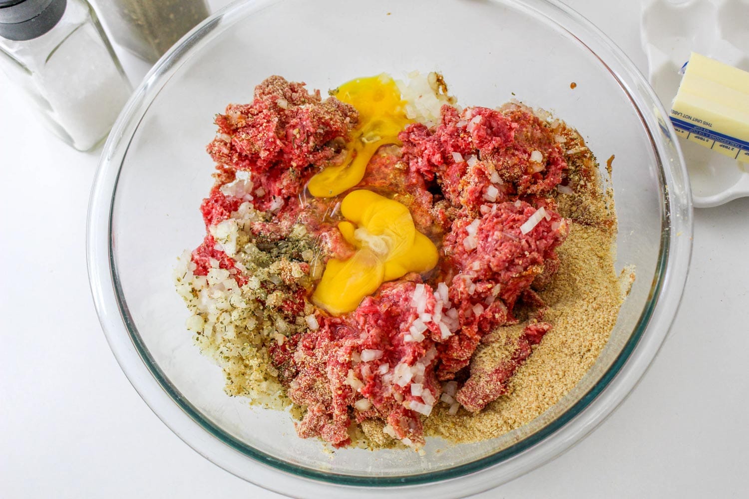 Meatloaf ingredients in a bowl before mixing