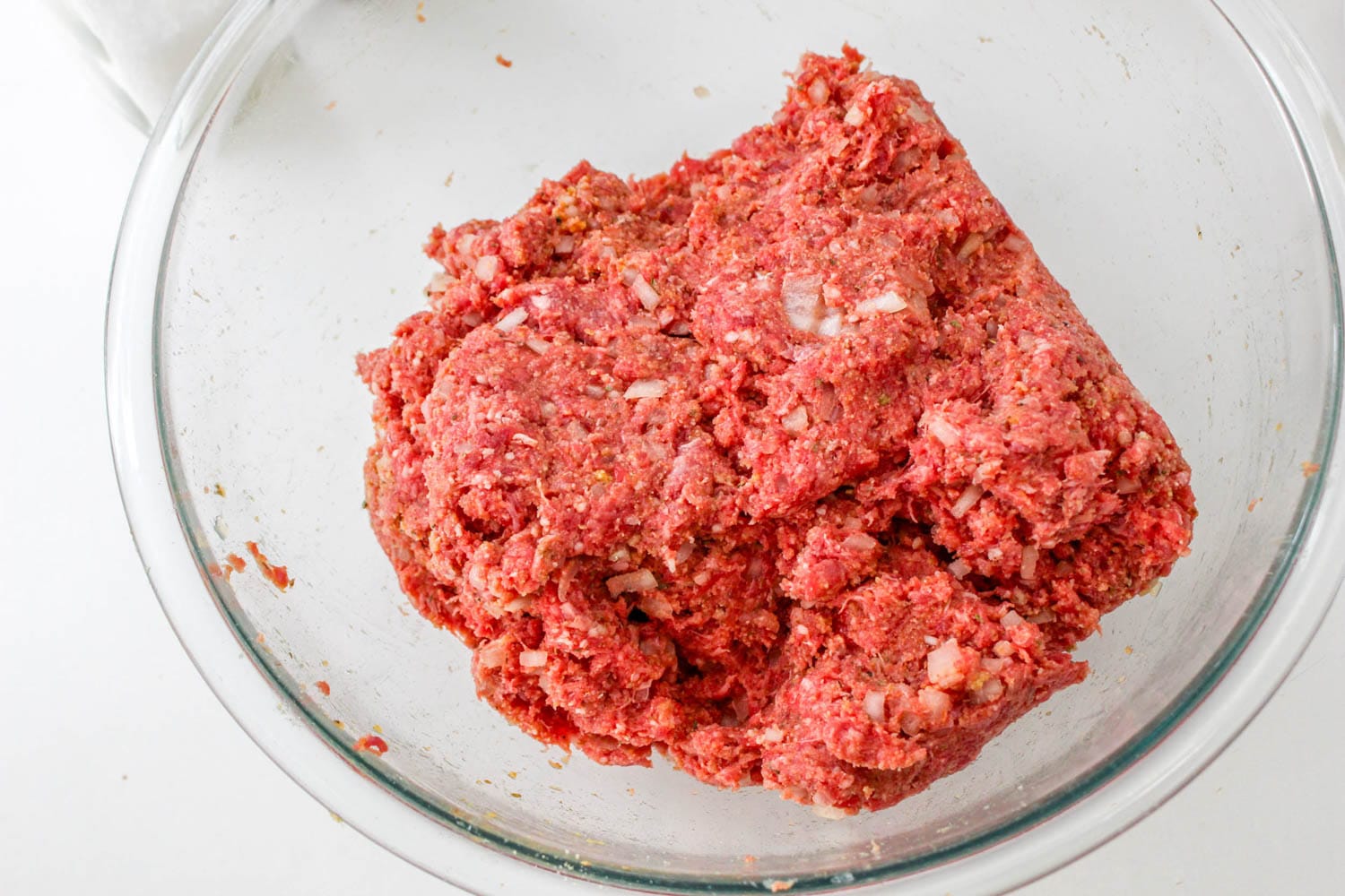 Meatloaf mixture in a glass bowl