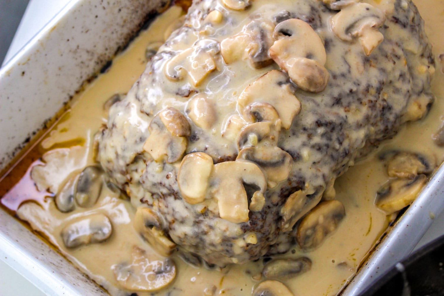 Creamy mushroom meatloaf in a pan