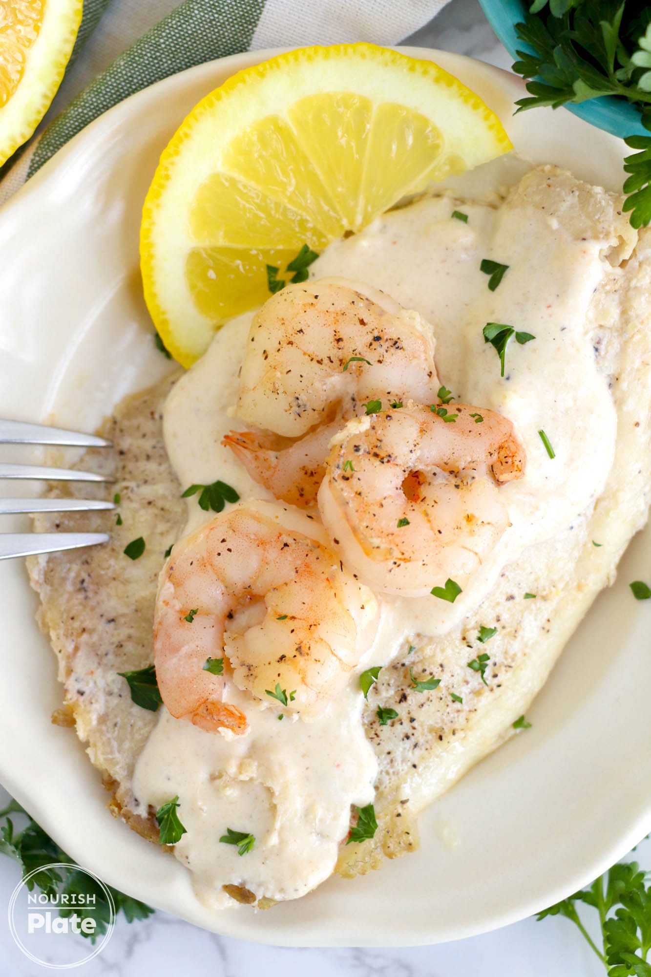 https://nourishplate.com/wp-content/uploads/2024/01/Pan-Seared-Tilapia-and-Shrimp-2.jpg?utm_source=chatgpt.com