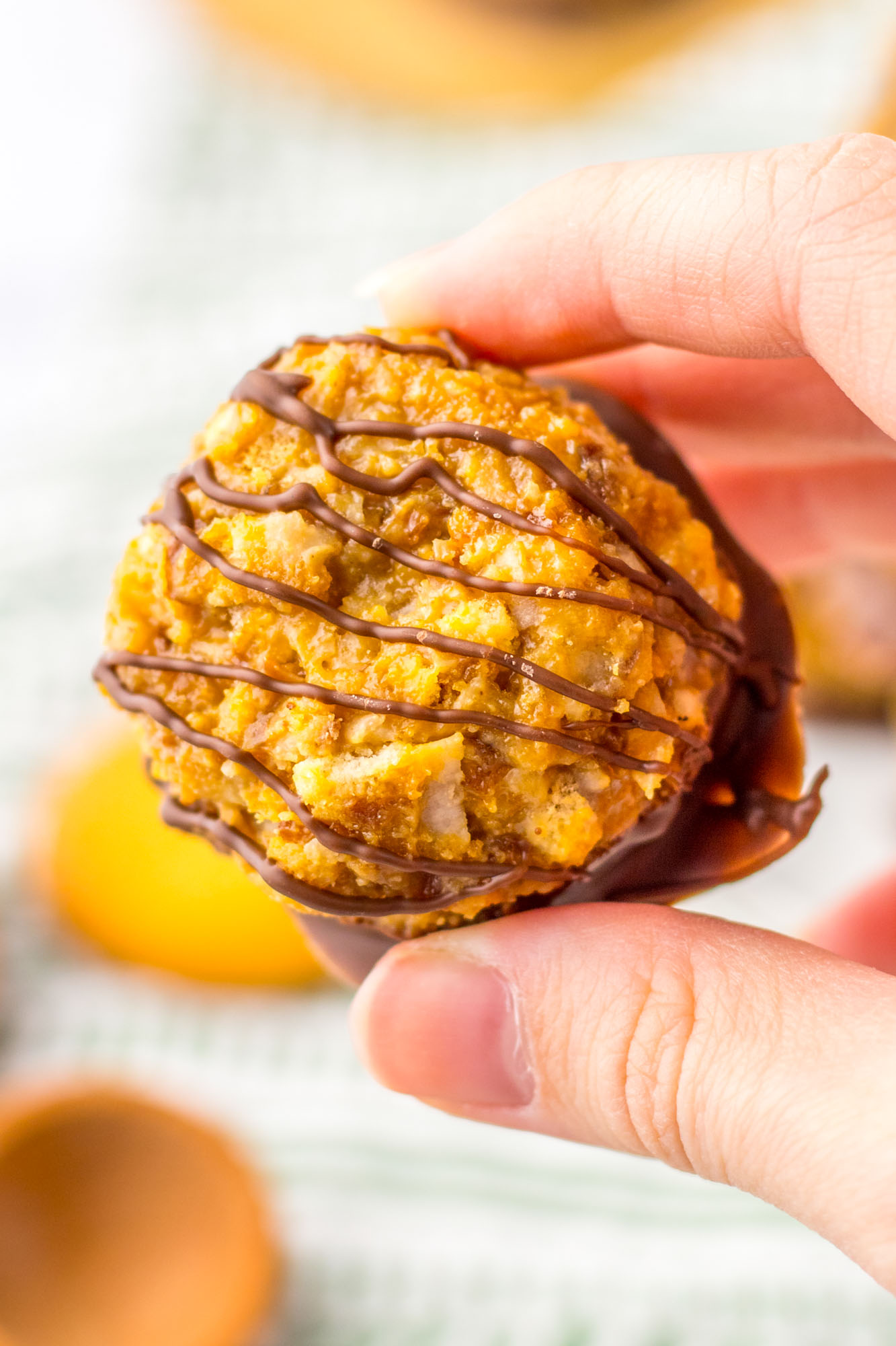 Holding a samoas truffle to show its texture up close