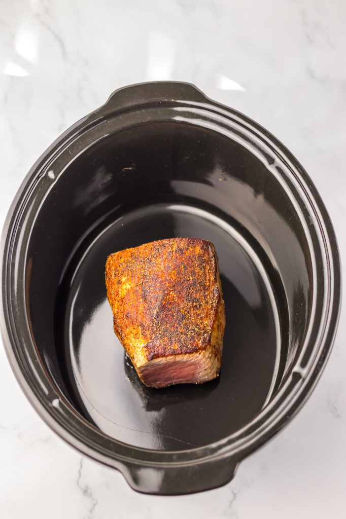 Seared eye of round roast in a slow cooker