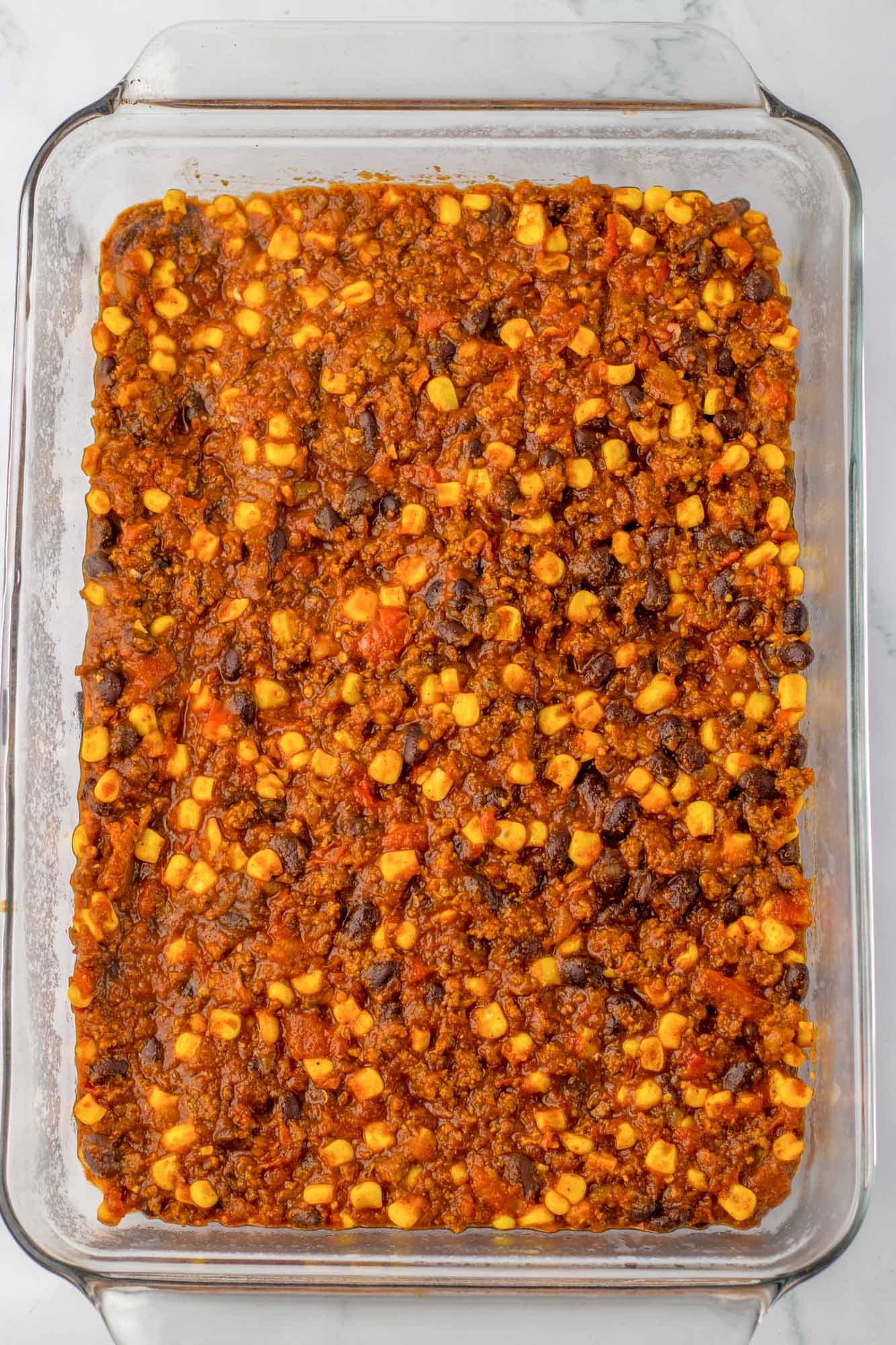 Chili mixture in a 9x13 inch pan, spreaded