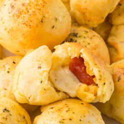 Stacked pizza bombs, with one open to show the inside